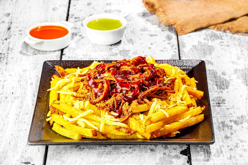 Loaded Ranch Fries with toppings and ranch sauce